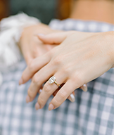 Lady's hand with oval diamond engagement ring