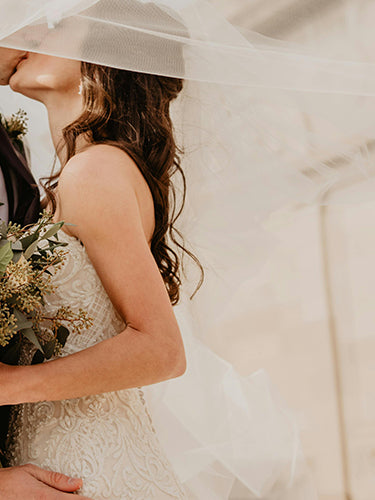 The newlyweds embraced each other while wearing lab-grown diamond wedding rings.